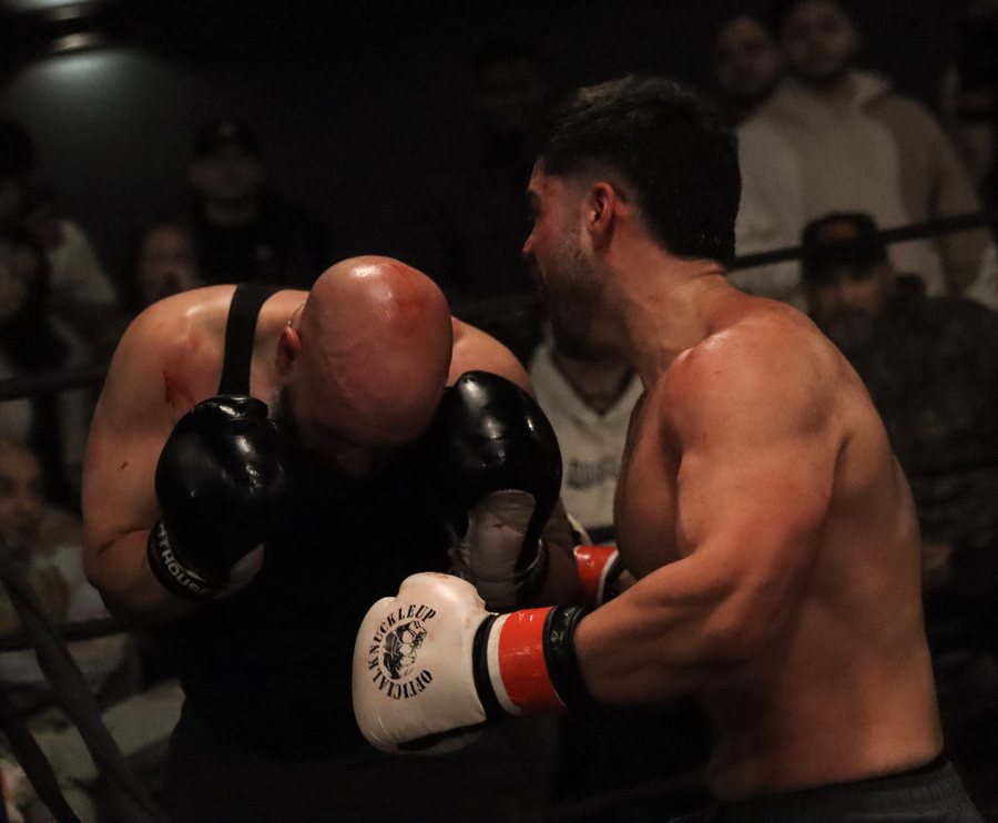 SparWars Vol. 14 boxing action — two fighters in the clinch