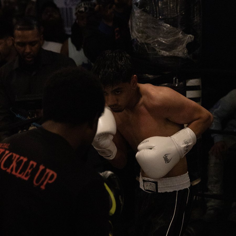 SparWars boxing action — a clean exchange in the ring